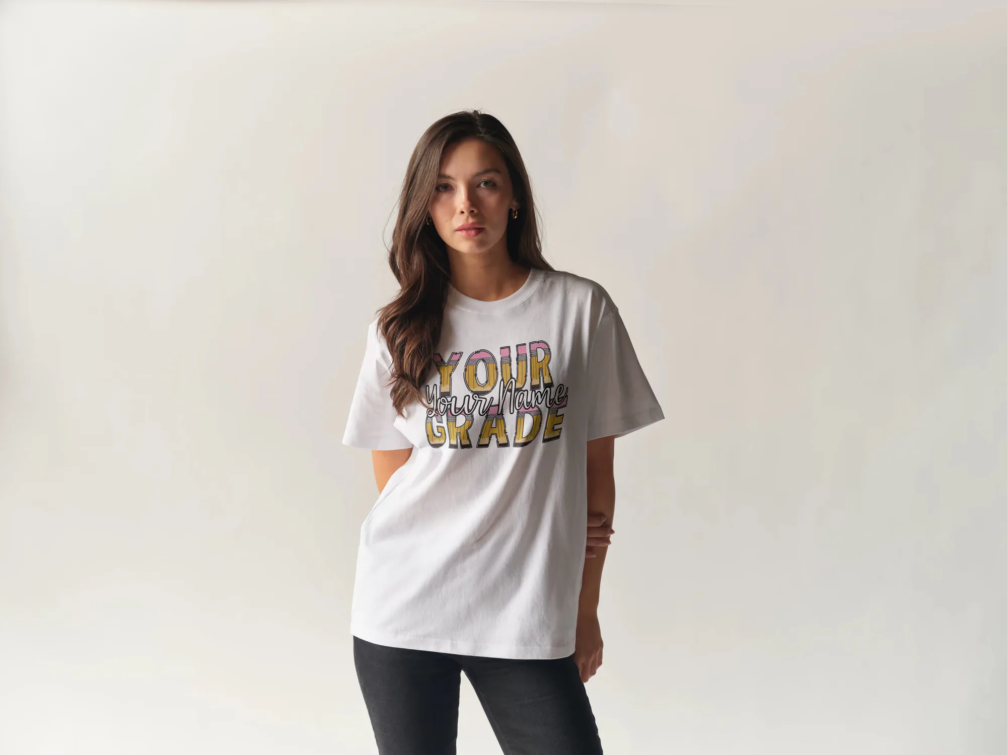 White custom teacher tee with colorful grade lettering
